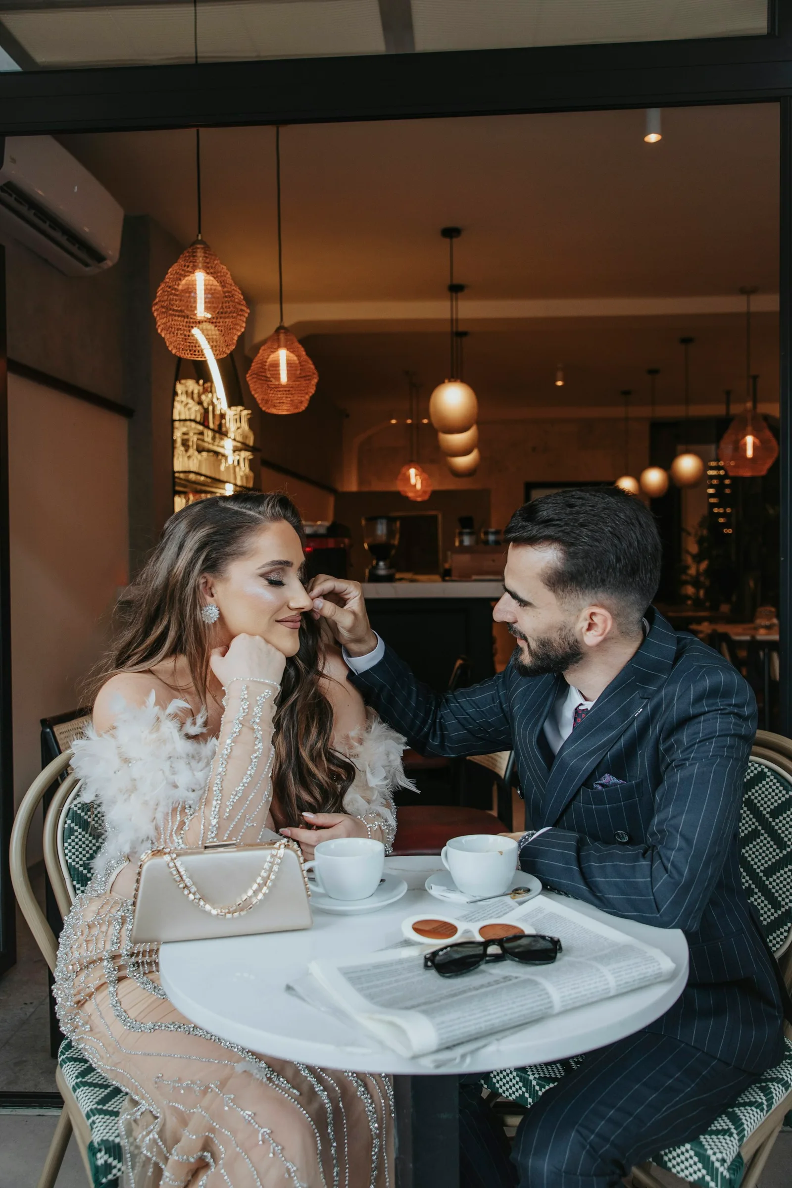 Illustrative couple meeting for coffee outdoors