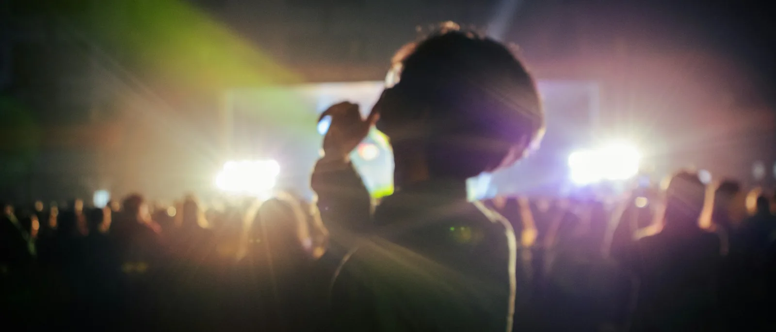 Illustrative live music performance with a festival audience