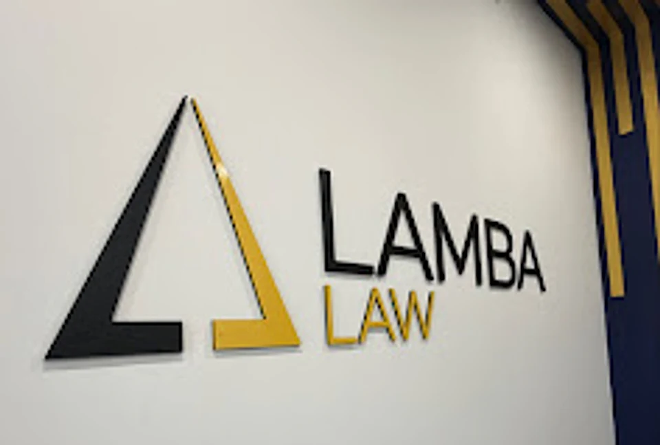 Lamba Law's office: the firm's logo on the reception wall