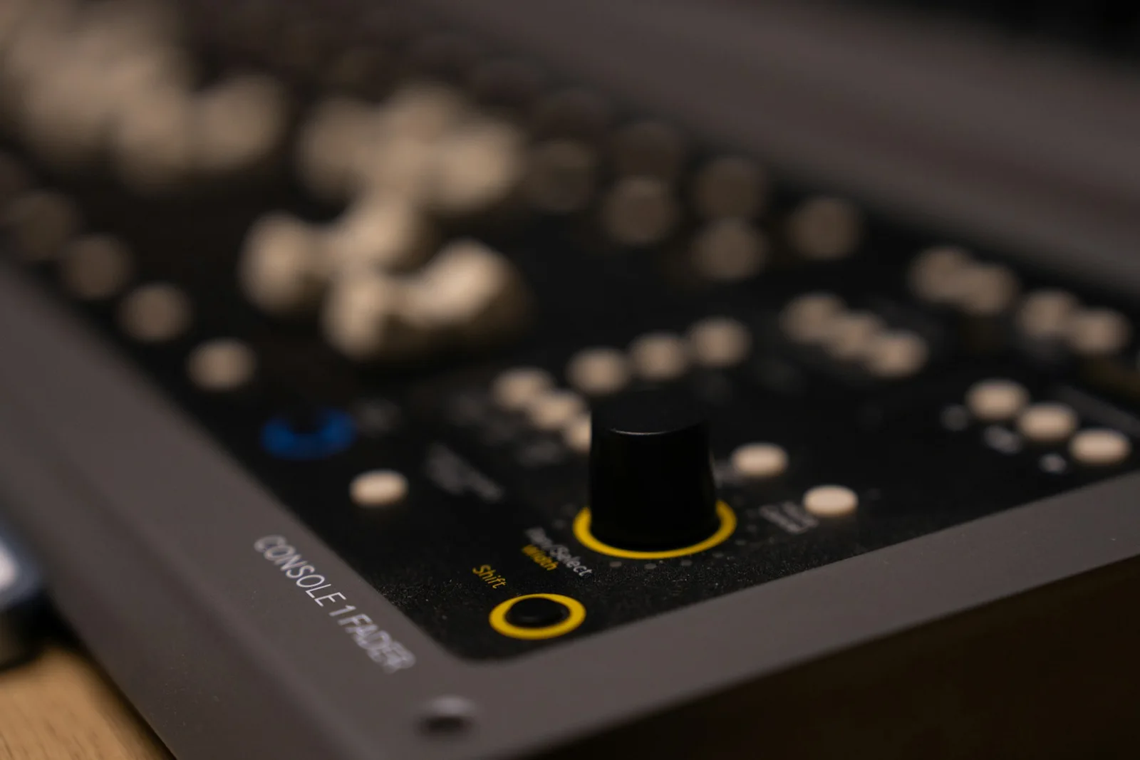 Illustrative close-up of a recording studio mixing console